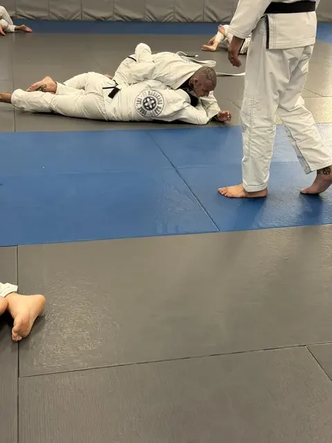 Maracaba BJJ instructor coaching students during class